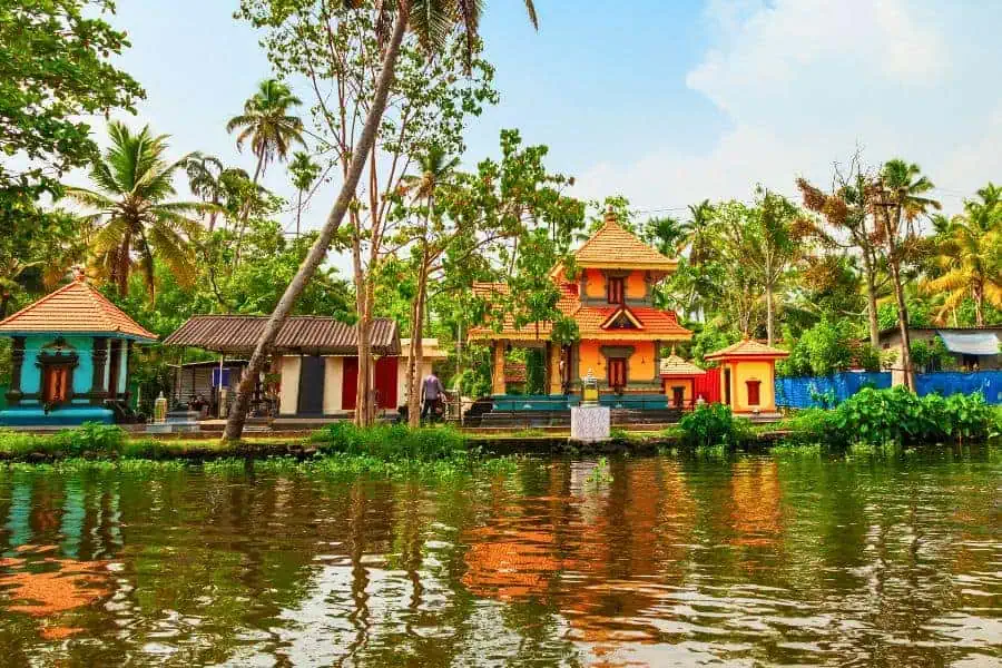 a beautiful village scene while cruising through the backwaters in alleppey alappuzha kerala