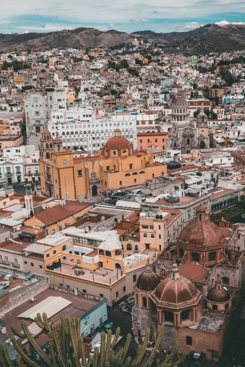 aerial view of guanajuato, mexico, featuring colorful colonial buildings and historic churches nestled within a mountainous landscape