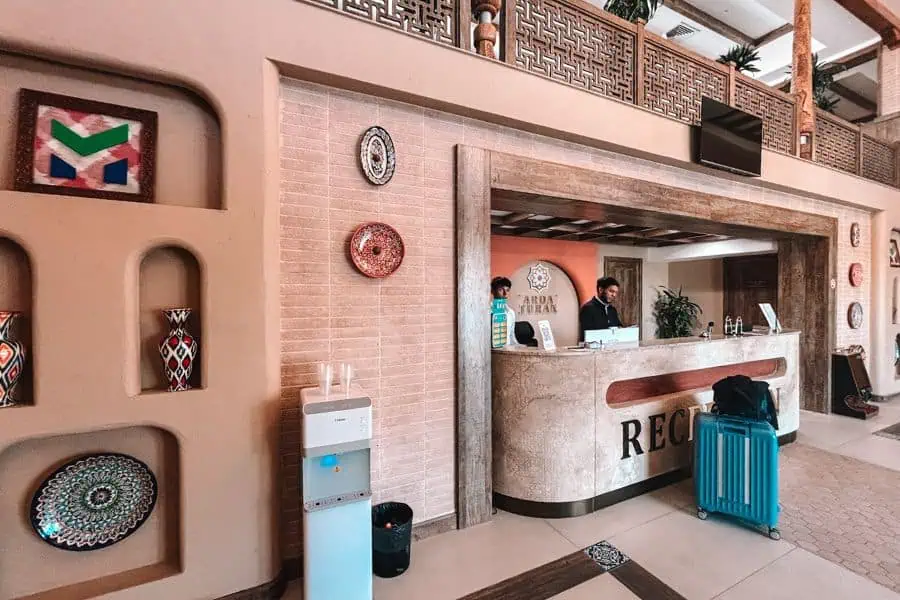 arda tarun boutique hotel reception in khiva with traditional decor and front desk counter