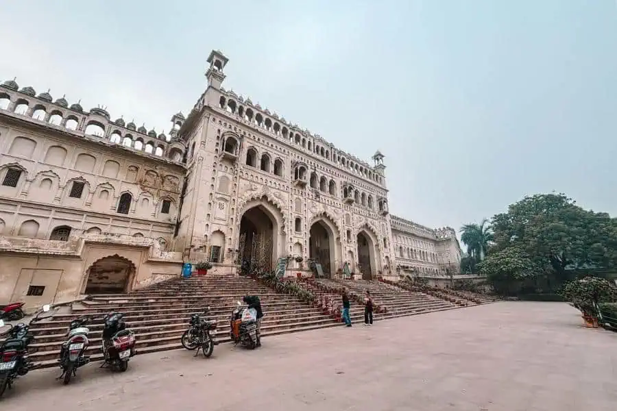 bara imambara complex in hussainabad with grand arched facade, wide steps, and open courtyard, lucknow