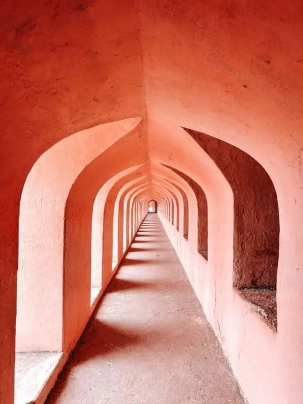 arched corridor inside bhulbhulaiya at bara imambara, lucknow