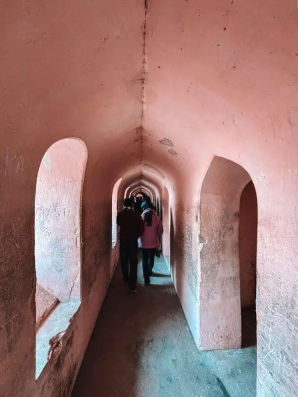 narrow bhulbhulaiya corridor with repeating arches inside bara imambara, lucknow
