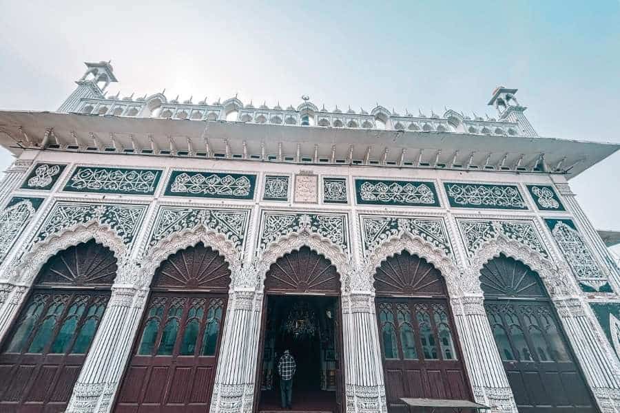 chota imambara facade with intricate calligraphy and arched entrances, lucknow