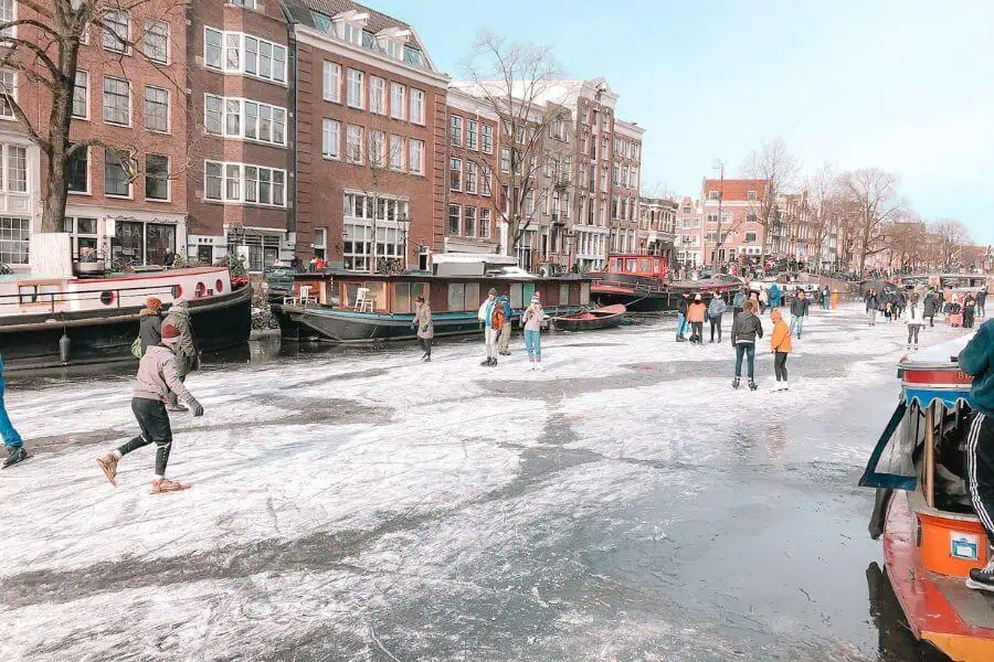 frozen amsterdam canal skating winter