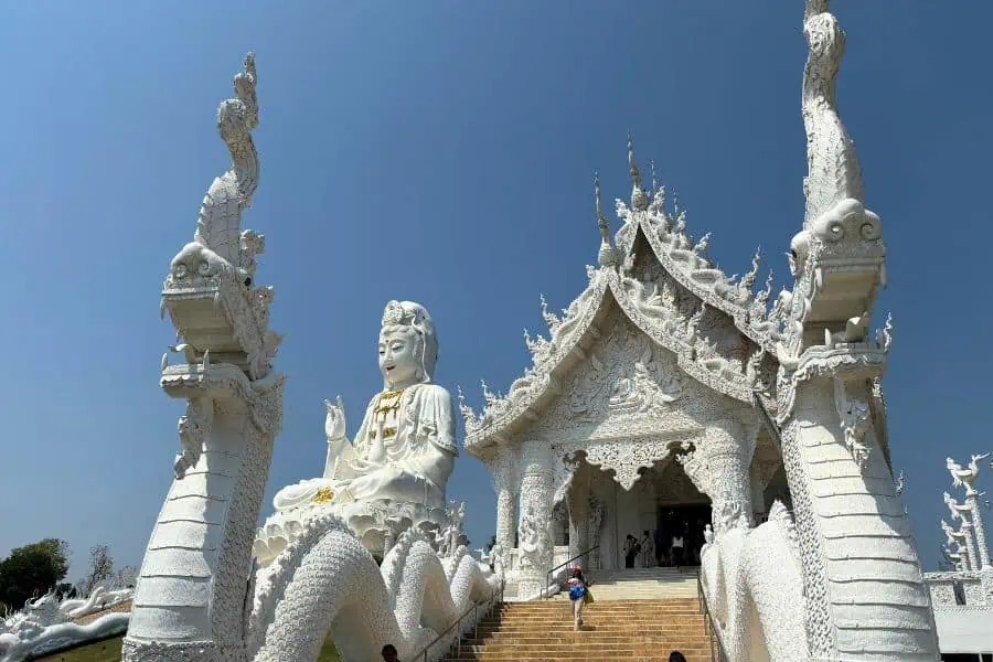 a huge white statue of guanyin aka a goddess of mercy at wat huay pla klang temple complex in chiang rai