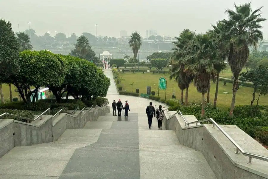 gomti riverfront park steps with landscaped gardens and palm trees, lucknow