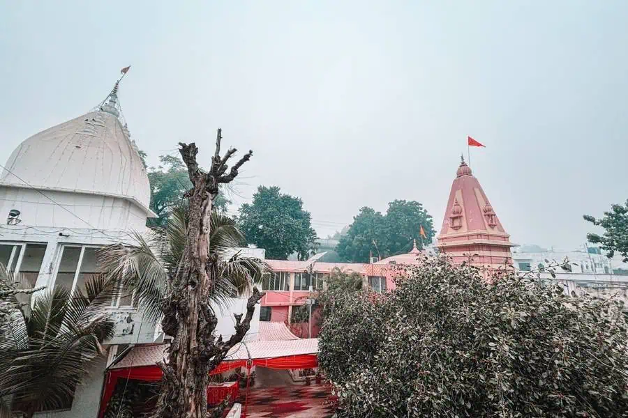 hanuman setu temple complex with white dome and pink shikhara topped with saffron flag, lucknow