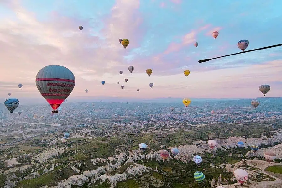 hot air balloon during sunrise over love valley