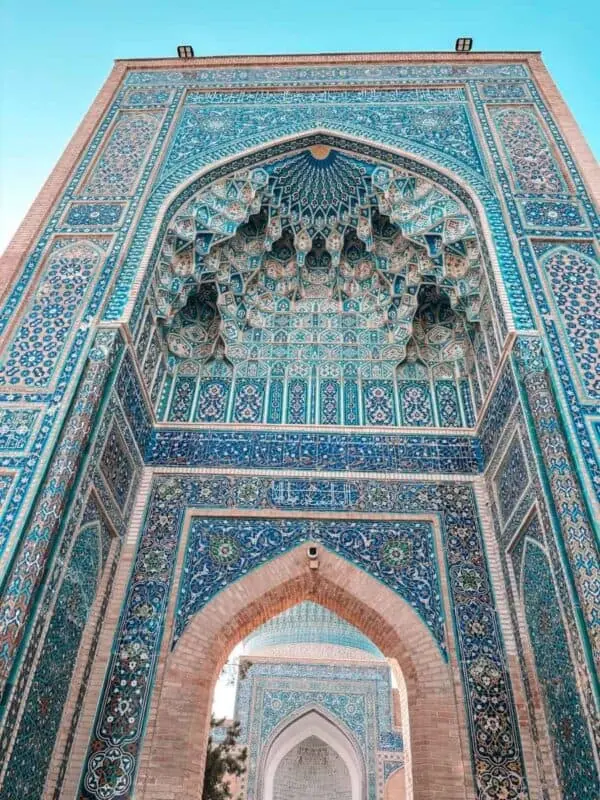 intricate muqarnas and blue tilework inside gur-e-amir mausoleum