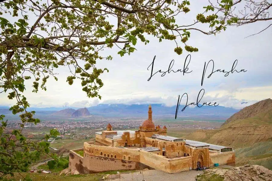 the historic ishak pasha palace sitting atop a hill with stunning valley views in the background