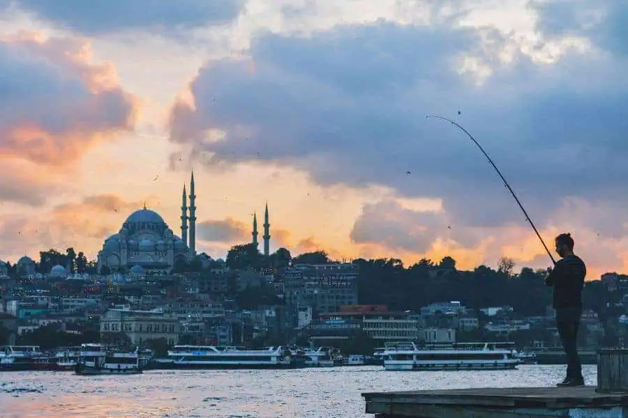 istanbul skyline and a fisherman turkey turkiye most visited countries world