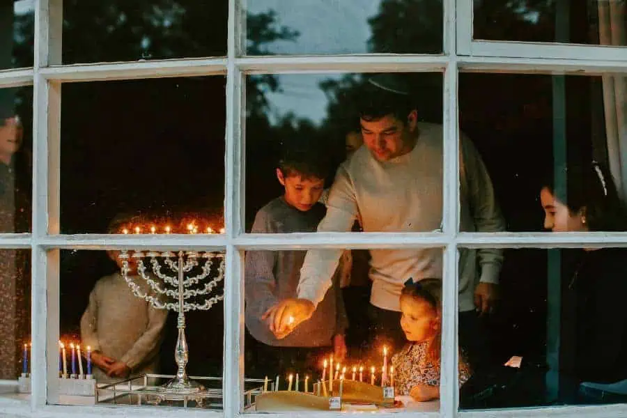 jewish family celebrating hanukkah festival of lights