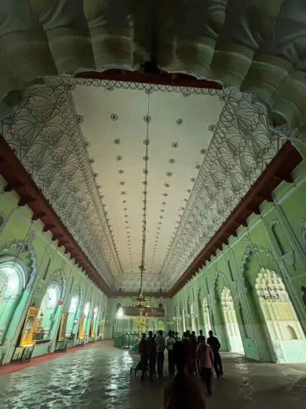long arched central hall with chandeliers inside bara imambara, lucknow