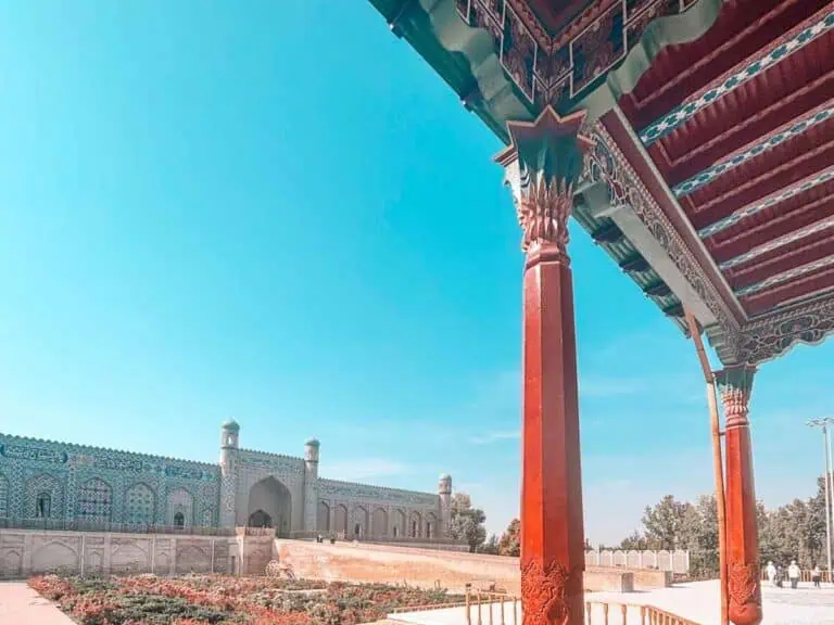 khudoyar khan palace in kokand in fergana valley with carved wooden columns and a bright clear sky