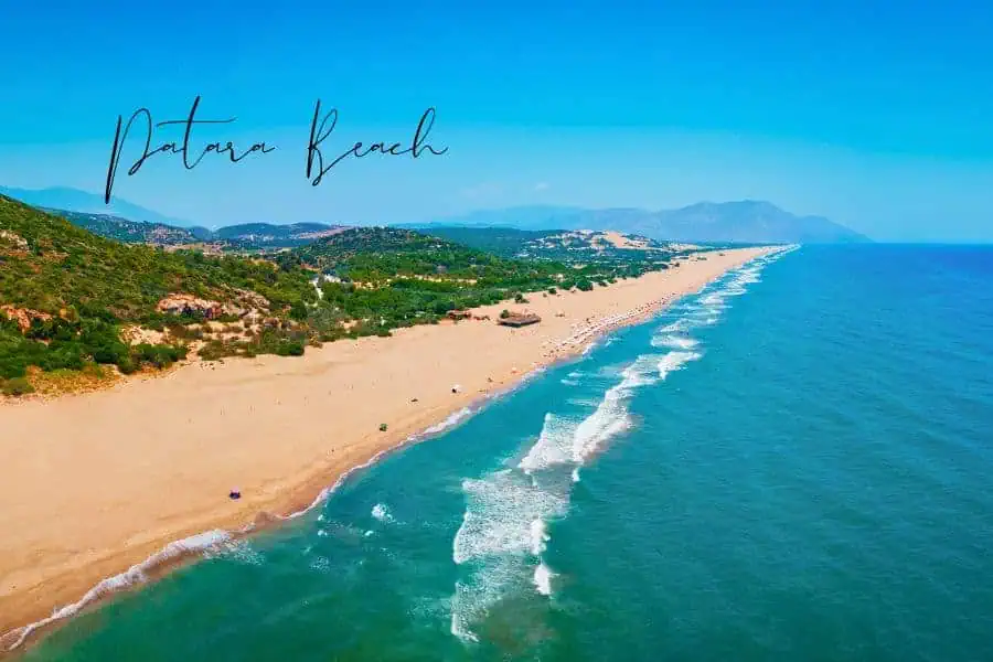 patara beach stretching along the coastline with golden sand and blue waves crashing ashore