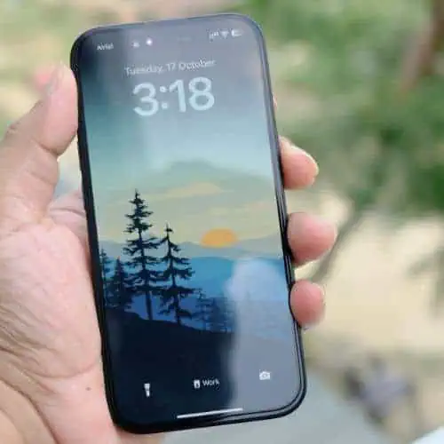 a person holding apple iphone 15 plus