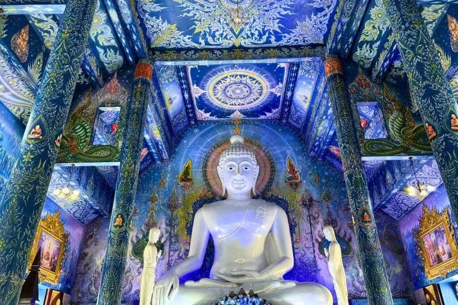 huge statue of buddha at rong suea ten blue temple chiang rai