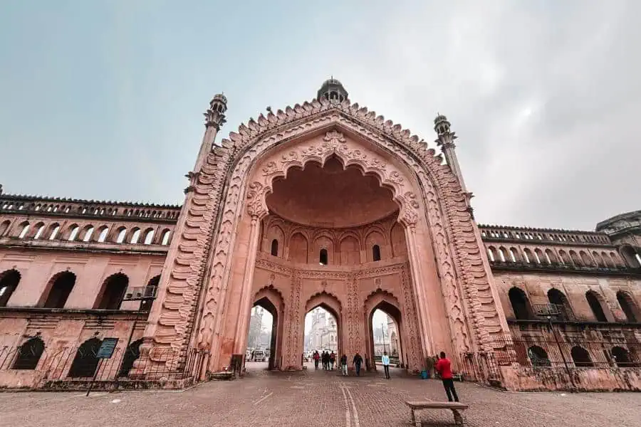 rumi darwaza grand arched gateway in old lucknow with people walking underneath