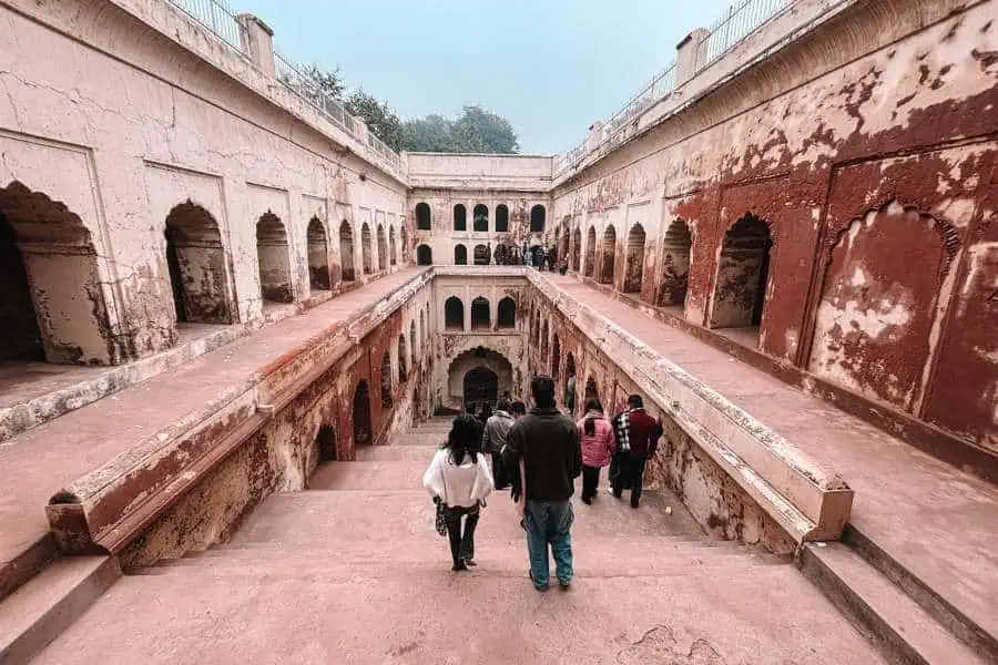 shahi baoli stepwell at bara imambara with arched corridors and descending steps, lucknow
