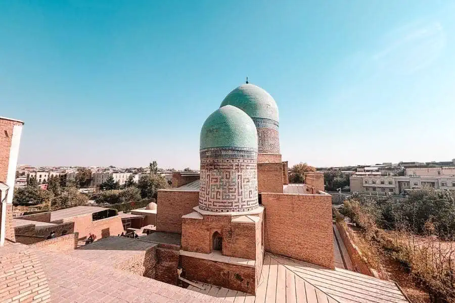 shahi zinda necropolis with turquoise domes overlooking samarkand