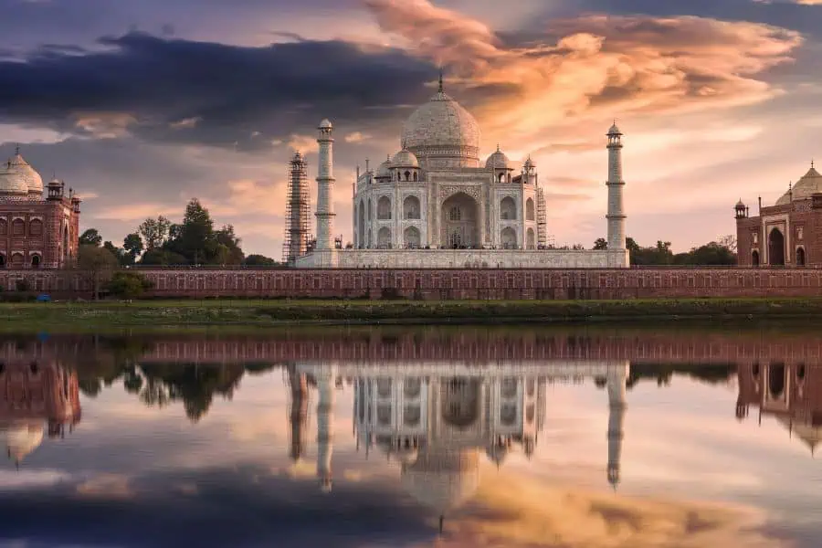 sunset view of taj mahal reflected in the yamuna river from mehtab bagh