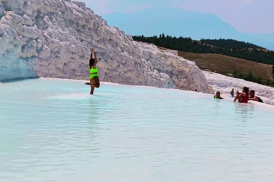 tourist Instagrammar posing at pamukkale travertine pools