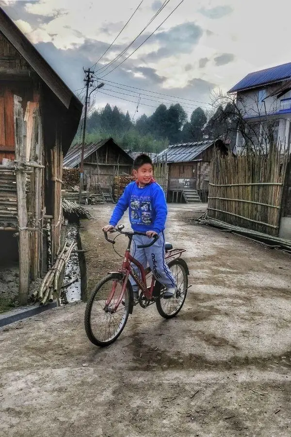apatani boy cycling in hija basti ziro valley