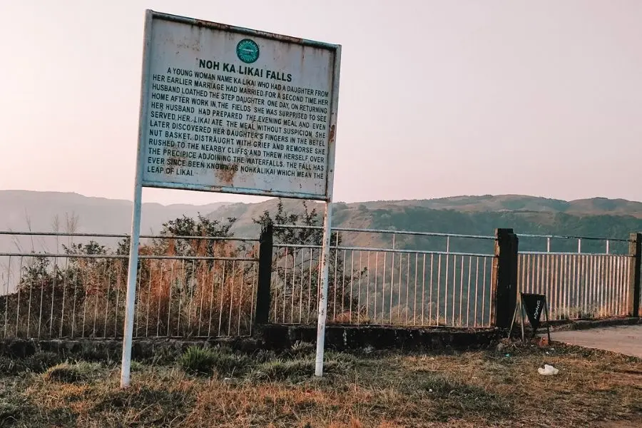 the board near the falls narrating the legend of nohkalikai falls