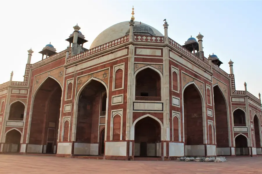 white marble dome with blue chhatris humayun's tomb