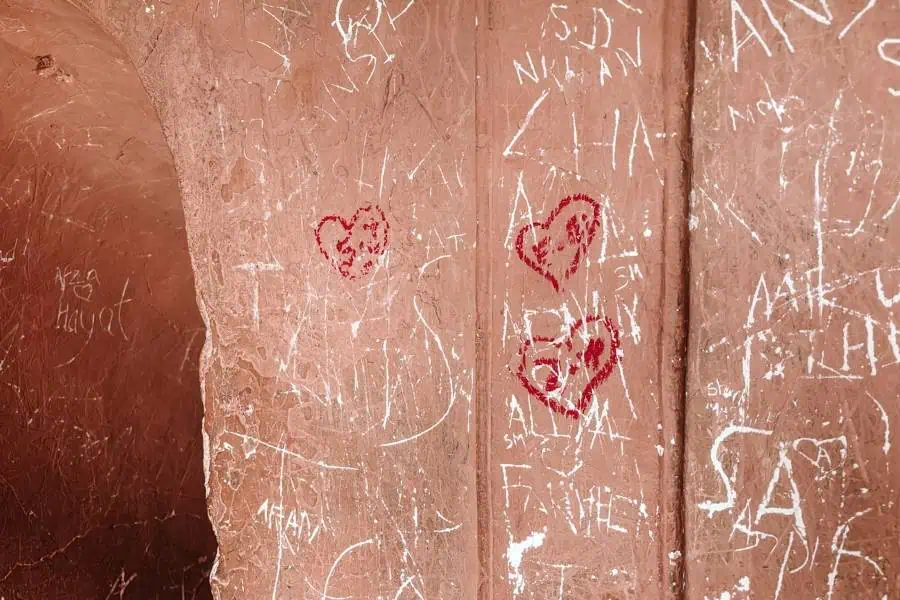 visitors carving names and hearts on bhool bhulaiya walls, damaging heritage at bara imambara, lucknow